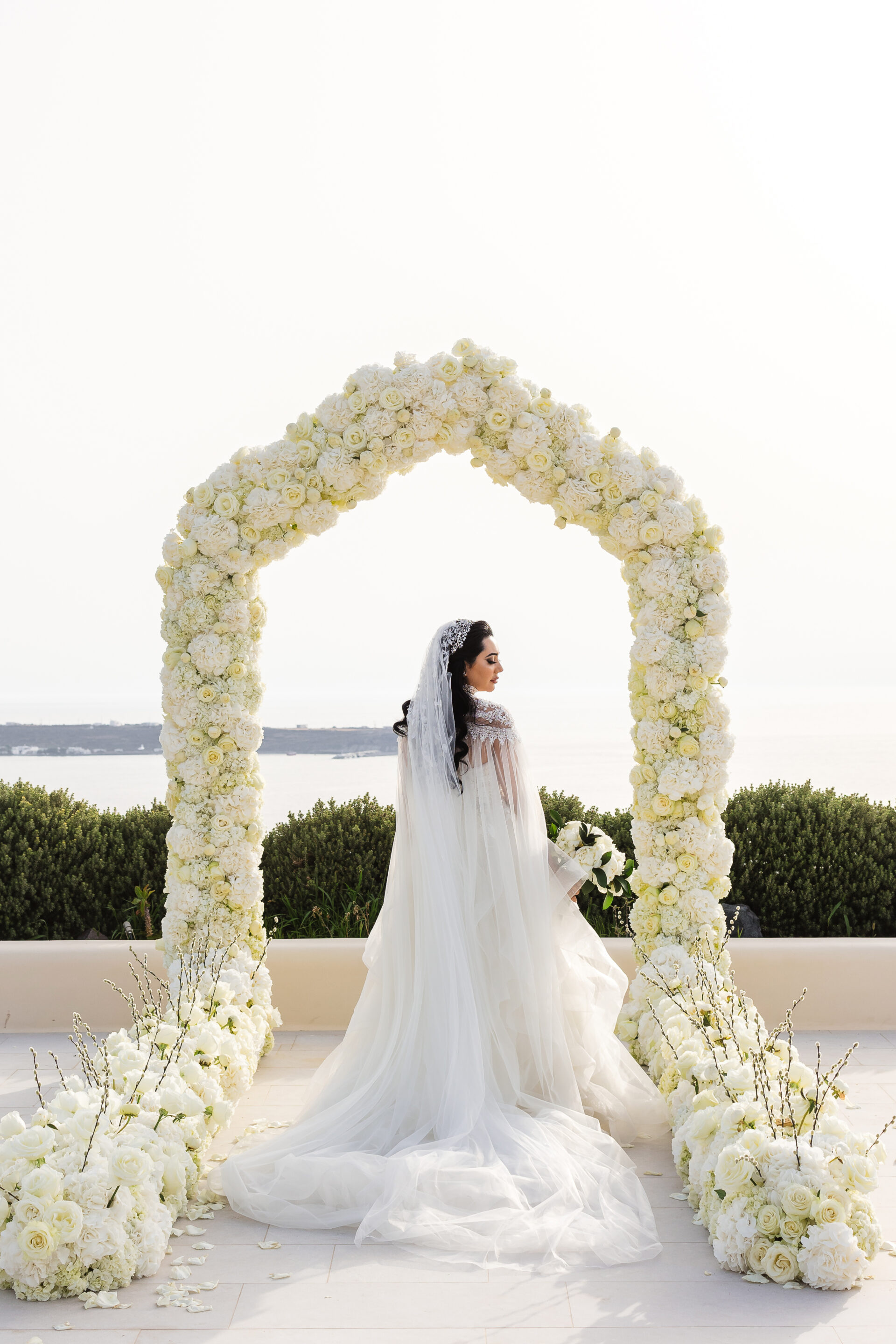 Santorini photographer bride floral arch