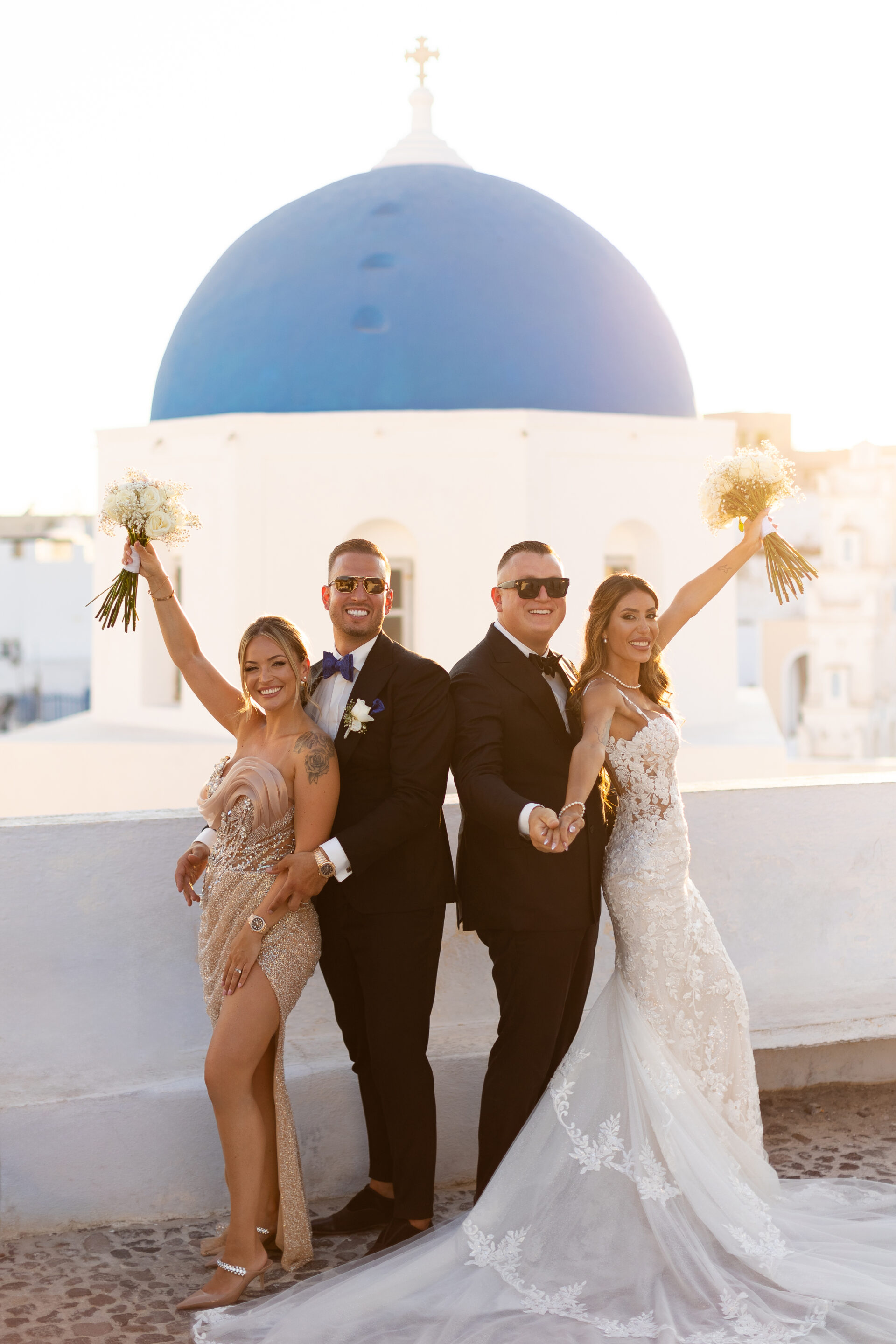 Santorini wedding photographer group photo blue dome