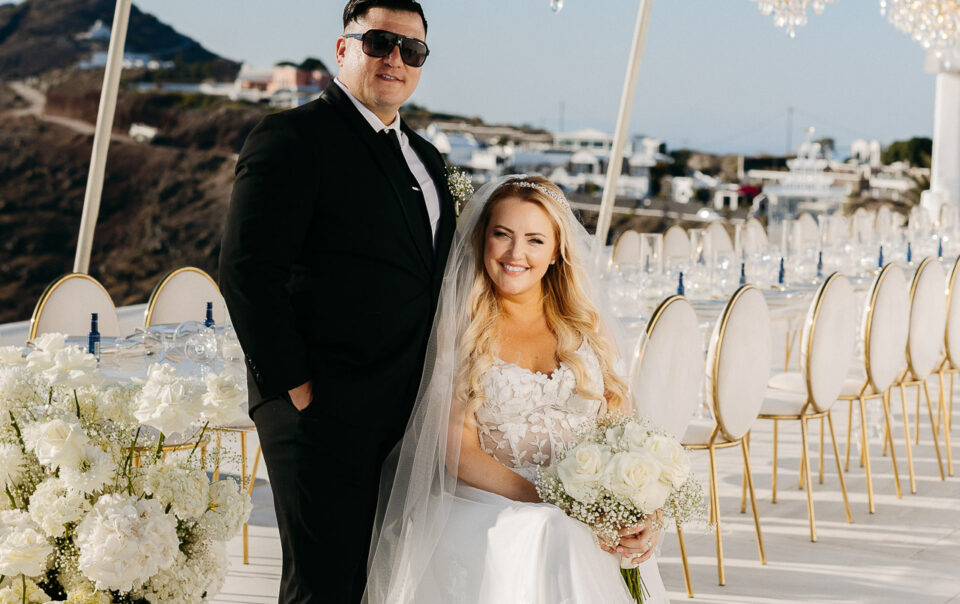 Bride and groom elegant portrait at reception in Santorini by Santorini wedding photographer