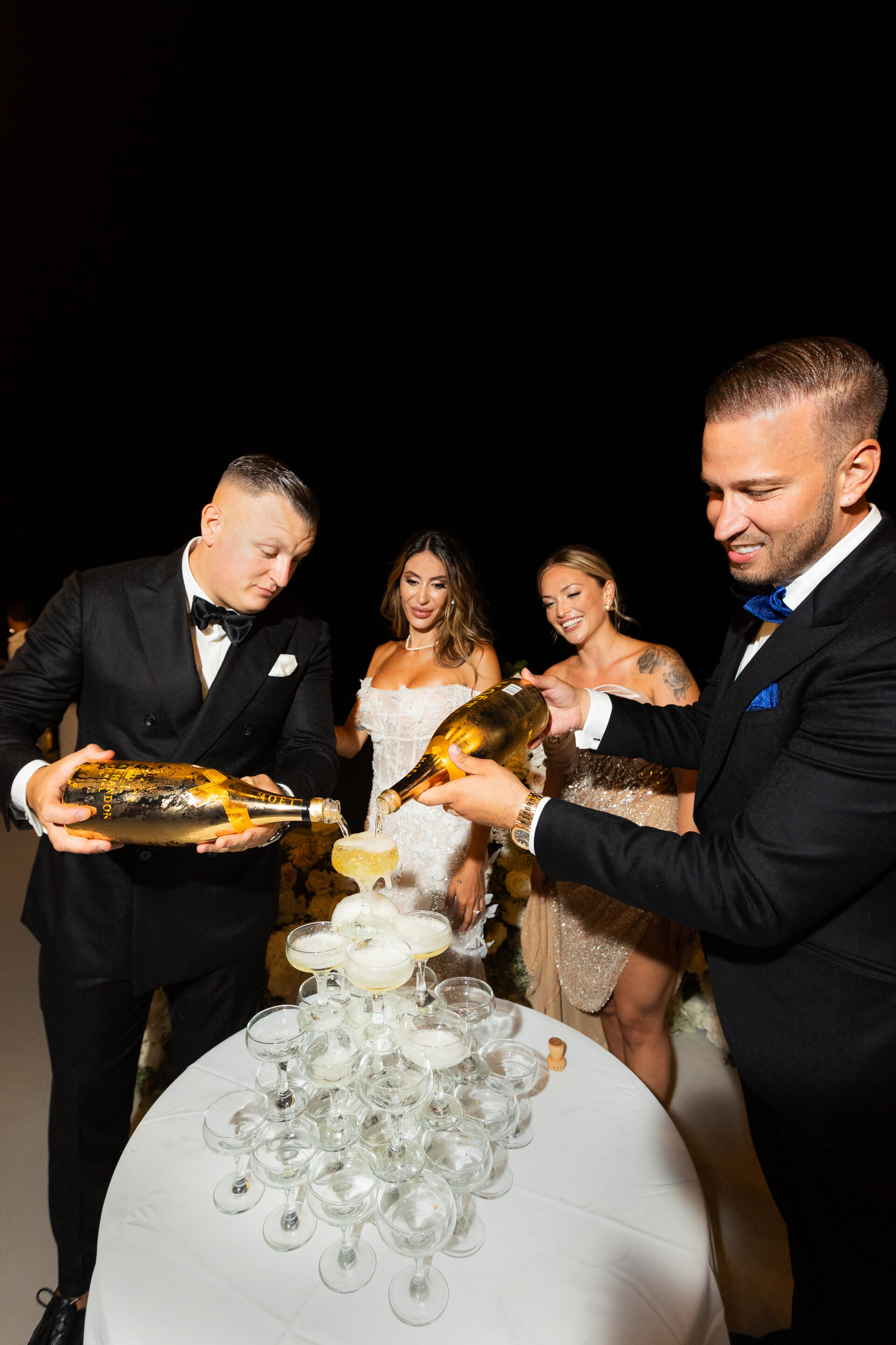 Santorini wedding photographer champagne tower celebration