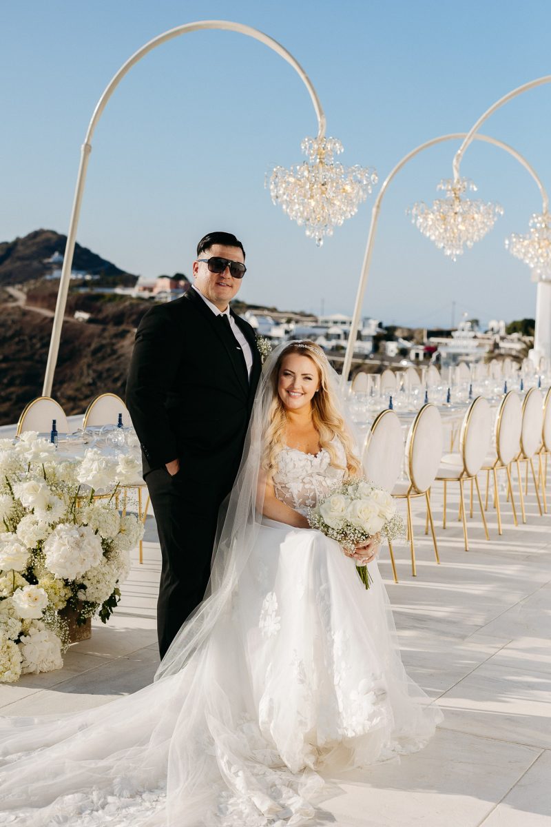 Bride and groom elegant portrait at reception in Santorini by Santorini wedding photographer