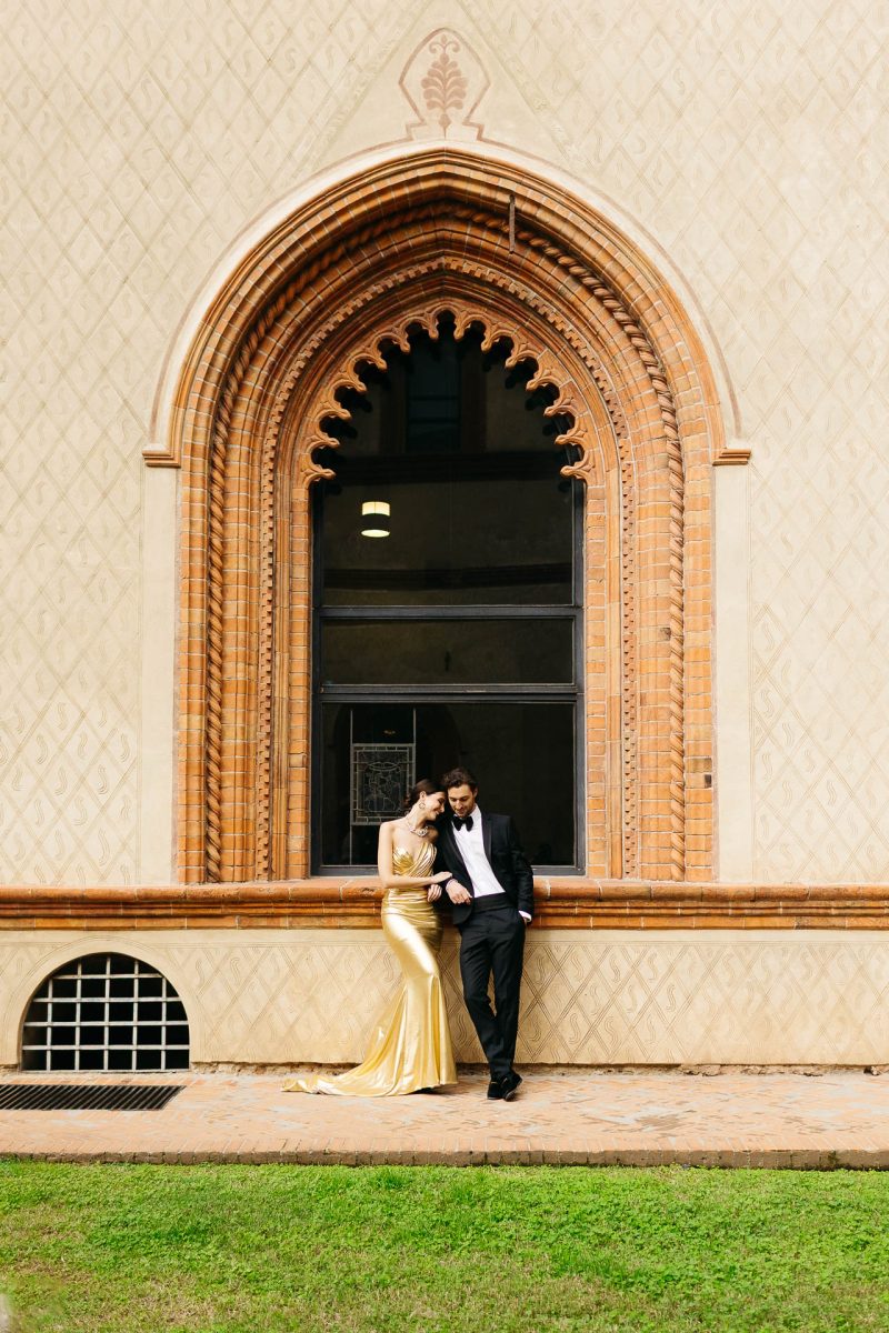 romantic couple by window santorini wedding photographer