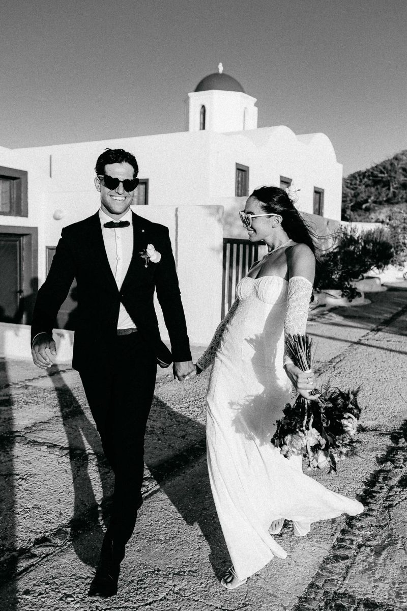 Santorini wedding photographer black and white couple walking