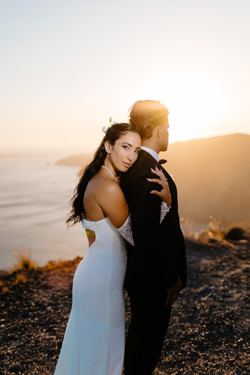 Santorini wedding photographer romantic couple portrait at sunset