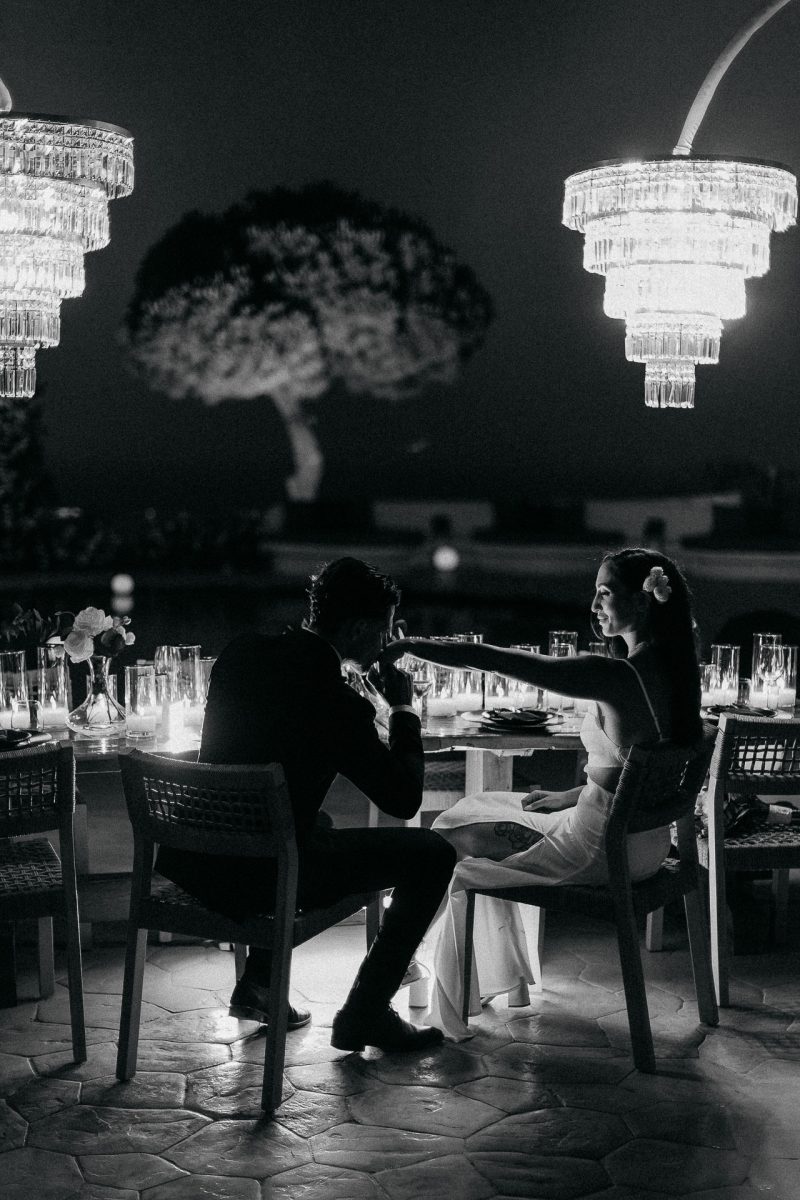 Santorini wedding photographer captures romantic bride and groom dinner moment