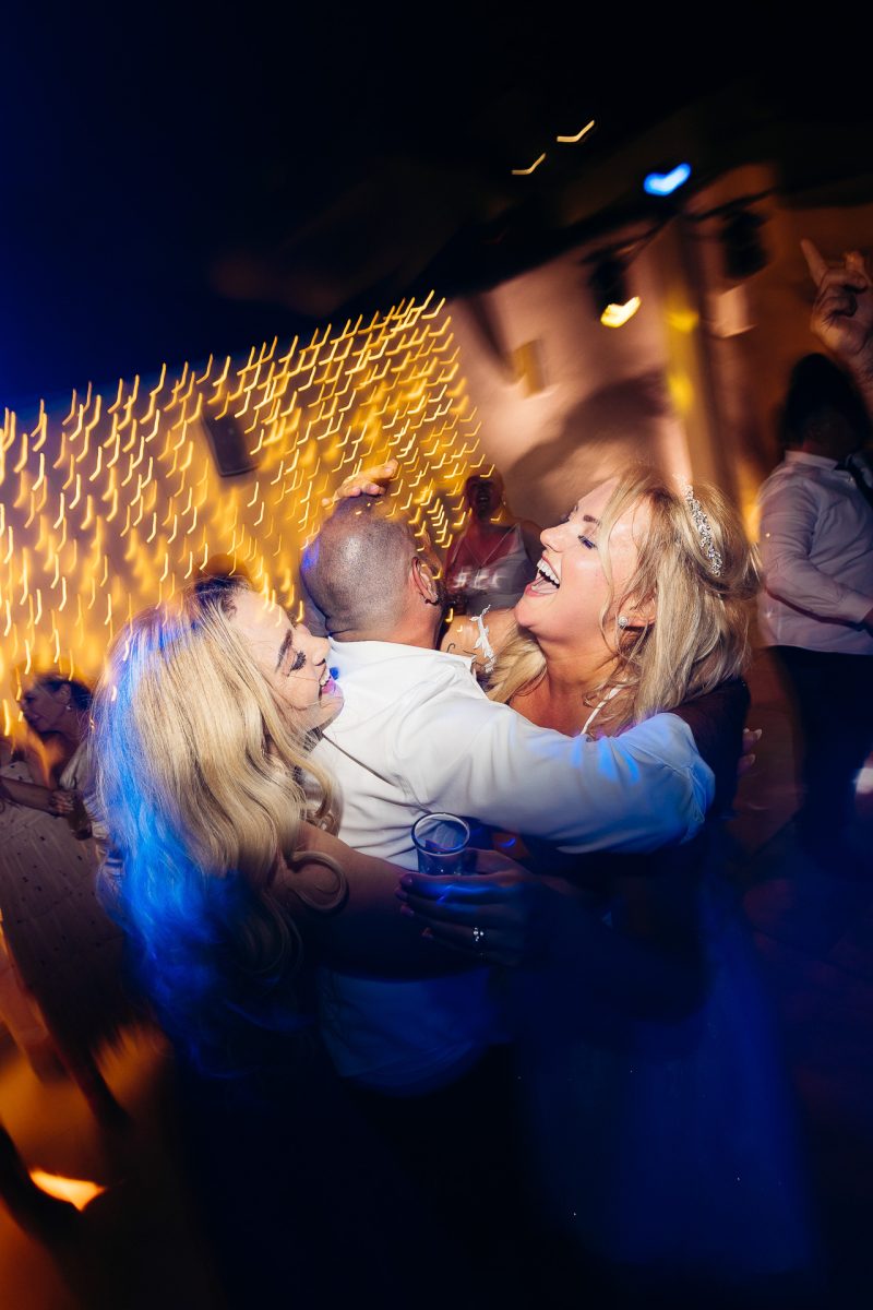 Bride and guests dancing at Santorini wedding reception