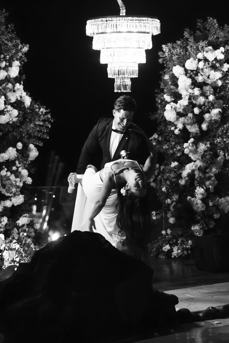 Santorini wedding photographer captures romantic first dance under chandelier at night
