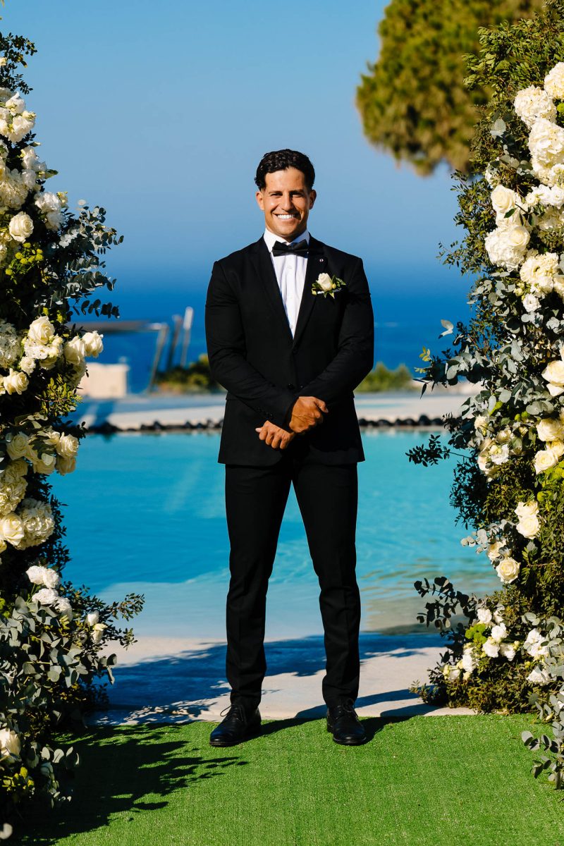 Groom smiling before wedding in Santorini, captured by Santorini wedding photographer